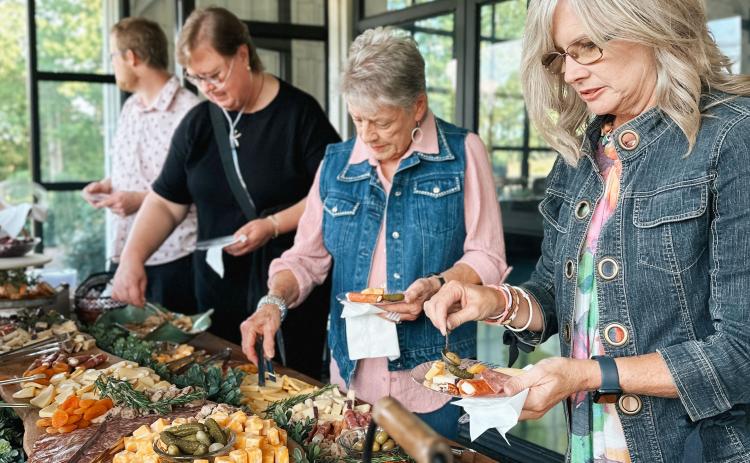 Guests serve themselves a charcuterie provided by Chattahoochee Cheese Market at last year's Celebrate Connection. SUBMITTED PHOTOS