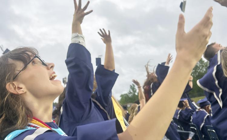 Wren Dennis, who graduated from White County High School this past May, throws her cap in the air. SUBMITTED PHOTO