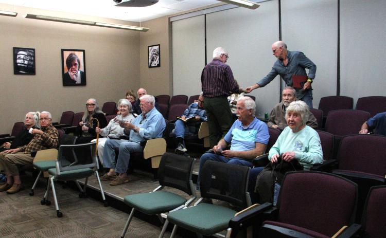 Members of the Foothills Photography Group participate in a discussion on AI and photography. MAE SULLENS/CNI
