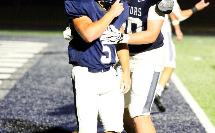 Jack Clark, left, celebrates with Jack Johnson after Clark scored the game-winning touchdown in the fourth quarter of the win over Gilmer. STACI SULHOFF/SPECIAL