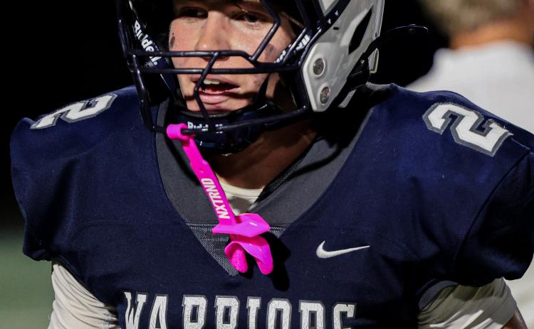 Zach Godfrey turned a 10-yard pass into a 98-yard scoring play in the fourth quarter to lead the Warriors to a 34-33 region win.  JENNIFER KNIGHT/SPECIAL